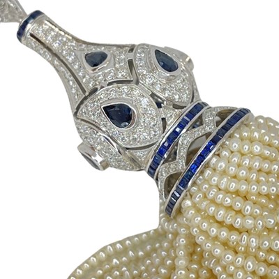 Lot 73 - Sapphire, Diamond and Pearl tassle pendant in 18ct white gold