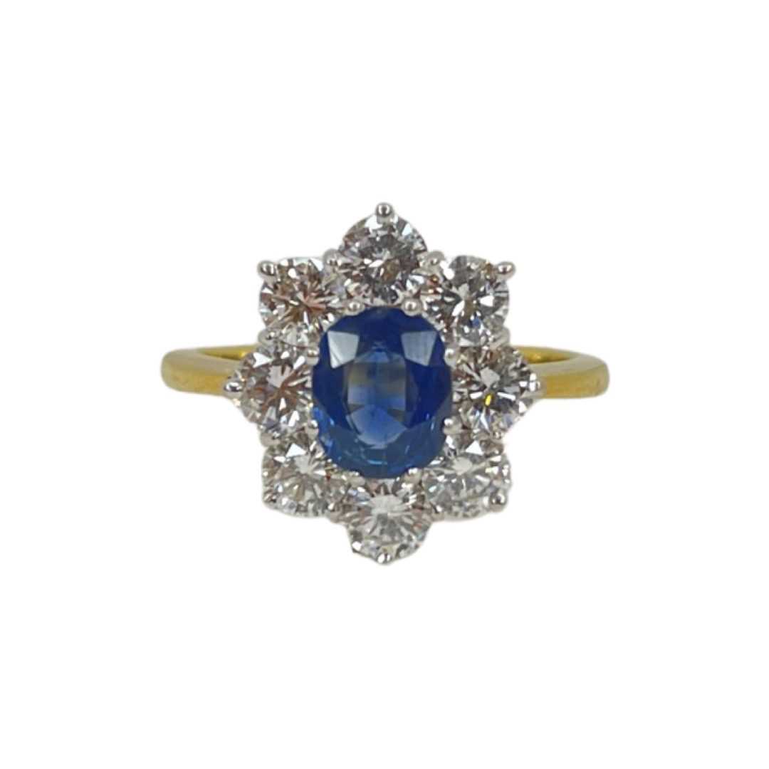 Lot 90 - An 18ct Sapphire and Diamond Cluster Ring