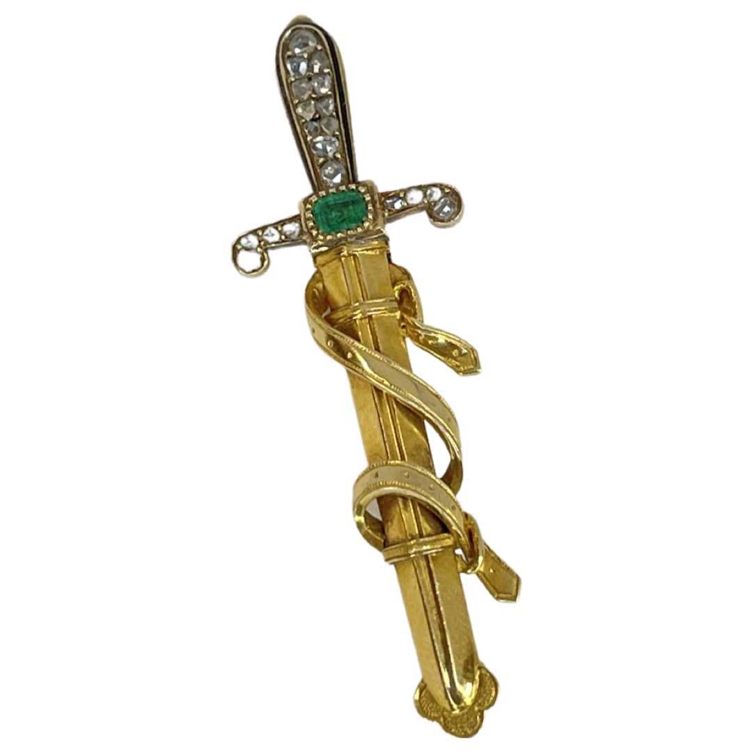 Lot 94 - A Victorian Emerald and Diamond set Sword Brooch