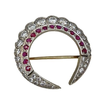 Lot 7 - A Diamond and Ruby Double Crescent Brooch, circa 1950.