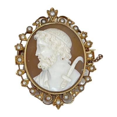 Lot 97 - An Antique Shell Cameo Brooch, Mounted in a Scrolled Gold and Split Pearl Frame, circa 1870.