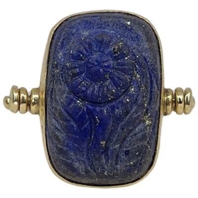Lot 60 - A Yellow Gold and Lapis Lazuli Dress Ring.
