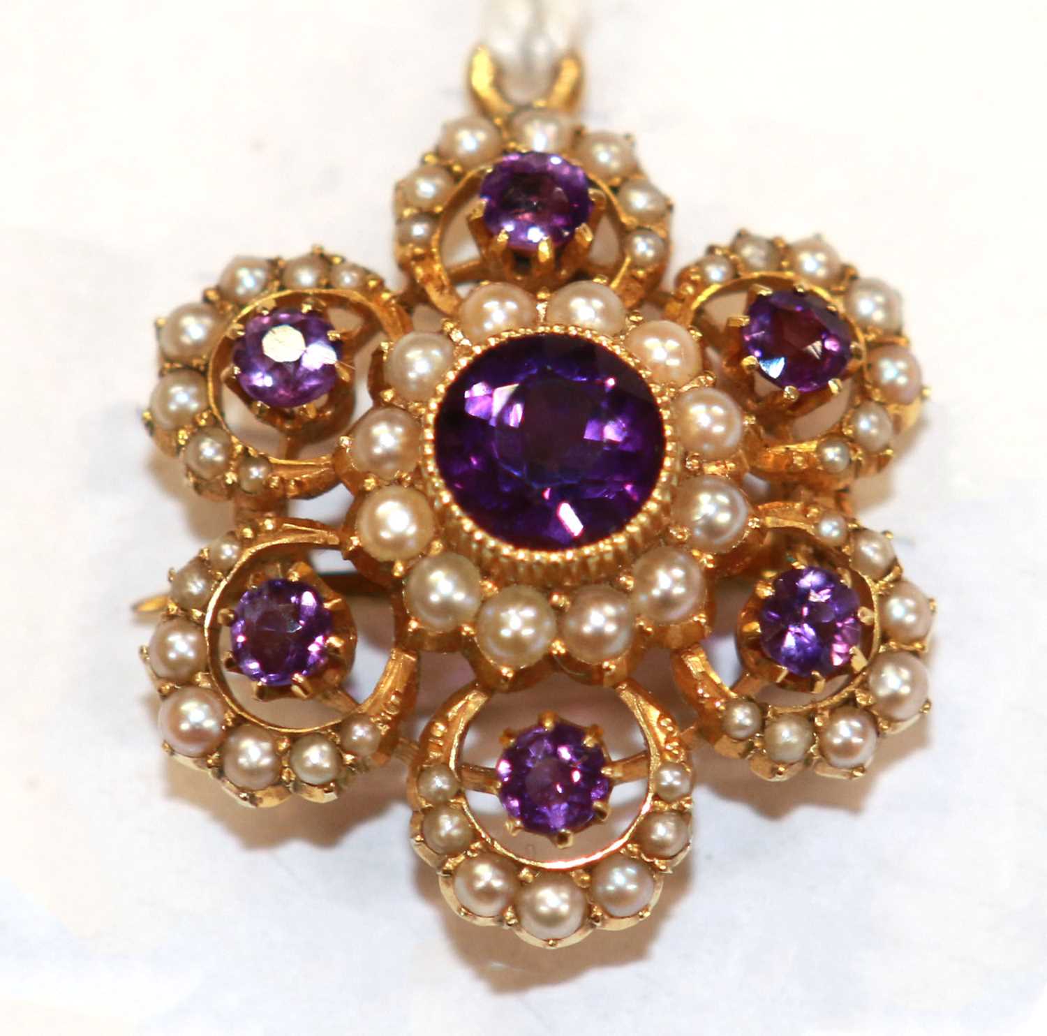 Lot 46 - An antique split pearl and Amethyst cluster brooch/pendant