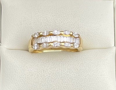 Lot 49 - A diamond set 18 carat gold half hoop band ring